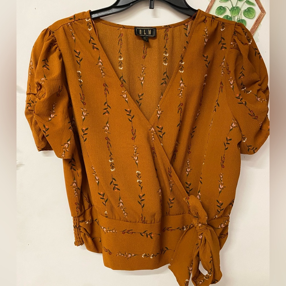 Medium burnt orange floral cropped blouse crossed over chest bow on the bottom